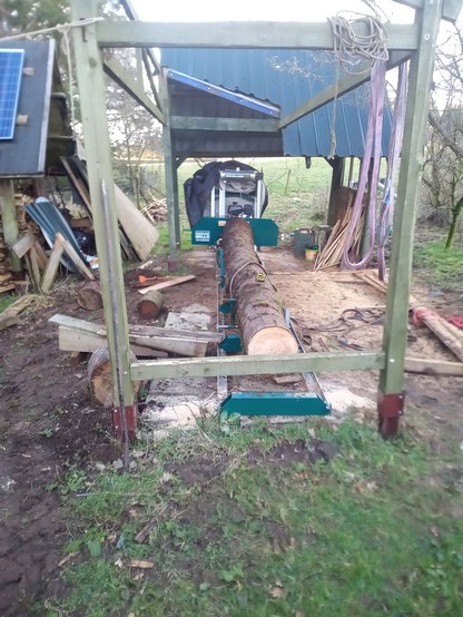 The big log absolutely filling the sawmill bed.