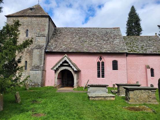 The gloriously pink rear face of St Mary's Kempley.