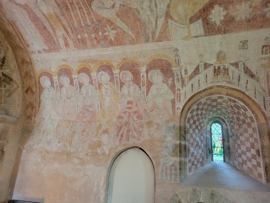 St Mary's Church, Kempley. Another view of the medieval wall painting of the Apostles, including the window previously described.